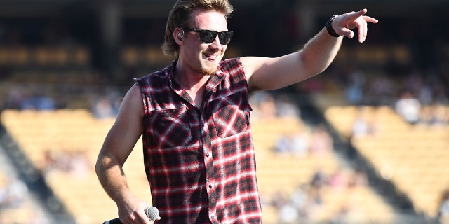 Morgan Wallen wears cutoff flannel shirt at Dodgers stadium