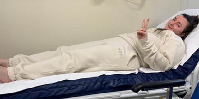 New bride Daisy Allen is shown at the hospital — where she had X-rays taken of her foot. 