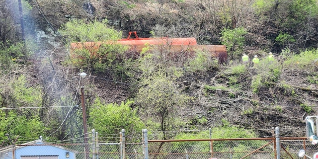 The derailment in Pittsburgh temporarily closed a local road as crews worked to remove the train cars.