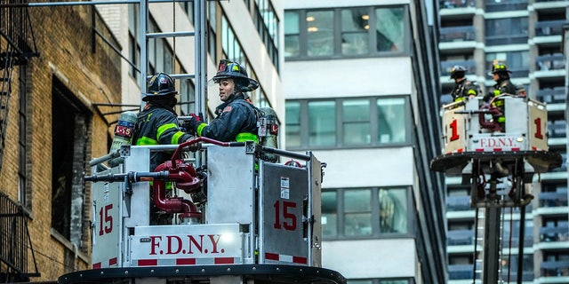 FDNY firefighters respond to a parking garage collapse on Ann Street.