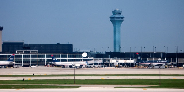 Control tower and Hilton Hotel O'Hare International Airport in Chicago, Illinois.
