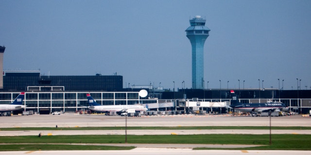 Control tower and Hilton Hotel O'Hare International Airport in Chicago, Illinois.