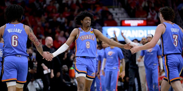 Oklahoma City Thunder forward Jalen Williams (8) celebrates with forward Jaylin Williams (6) and guard Josh Giddey (3) during the first half of the team's NBA basketball tournament game against the New Orleans Pelicans in New Orleans, on Wednesday in April.  12, 2023. 