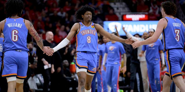 Oklahoma City Thunder forward Jalen Williams (8) celebrates with forward Jaylin Williams (6) and guard Josh Giddey (3) during the first half of the team's NBA basketball tournament game against the New Orleans Pelicans in New Orleans, on Wednesday in April.  12, 2023. 