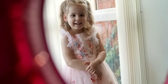 Little Olivia is seen here on her third birthday. Typical signs of the eye cancer she experienced include a white glow, which may only appear in certain lights or angles.