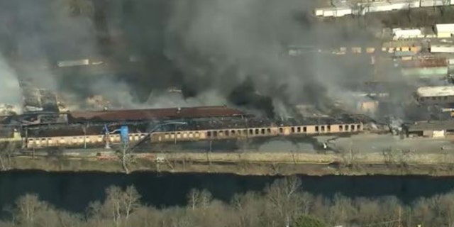 The warehouse on fire is near the Lehigh River in West Easton, Pennsylvania.