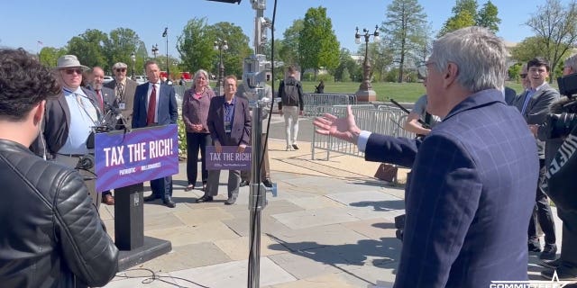 Stephen Moore hands out petitions during Patriotic Millionares conference