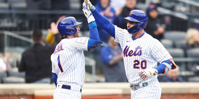 Pete Alonso (20) of the New York Mets celebrates with Jeff McNeil (1) after hitting a home run in the eighth inning against the Miami Marlins during the home opener at Citi Field April 7, 2023, in the Flushing neighborhood of the Queens borough of New York City. 