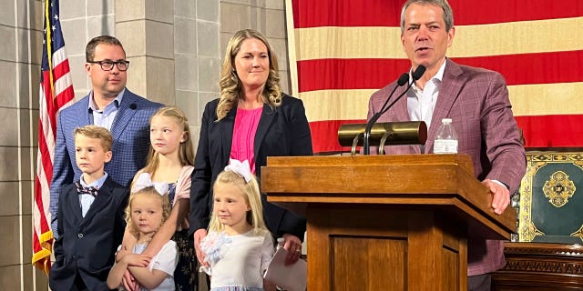 Republican Nebraska Gov. Jim Pillen (right) appointed former prosecutor Carolyn Bosn (center) to the state Legislature on Thursday.