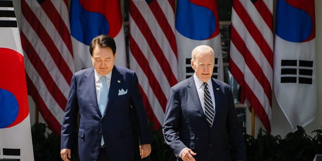 South Korean President Yoon Suk Yeol and President Joe Biden arrive for a joint press conference