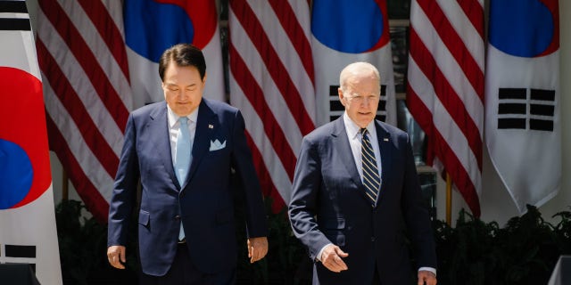South Korean President Yoon Suk Yeol and President Joe Biden arrive for a joint press conference