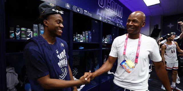 Alumni Ray Allen shakes hands with Nahiem Alleyne #4 of the Connecticut Huskies after they defeated the San Diego State Aztecs to win the NCAA Men's Basketball Tournament National Championship at NRG Stadium on April 03, 2023 in Houston, Texas. 