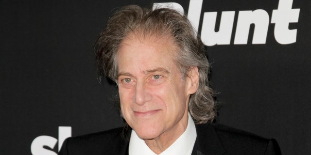 Richard Lewis poses at a movie premiere.