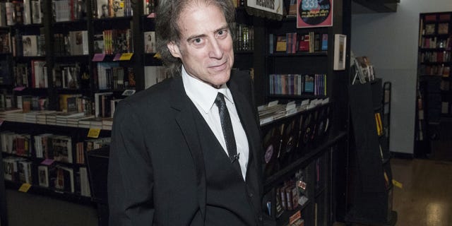 Richard Lewis poses at a book signing