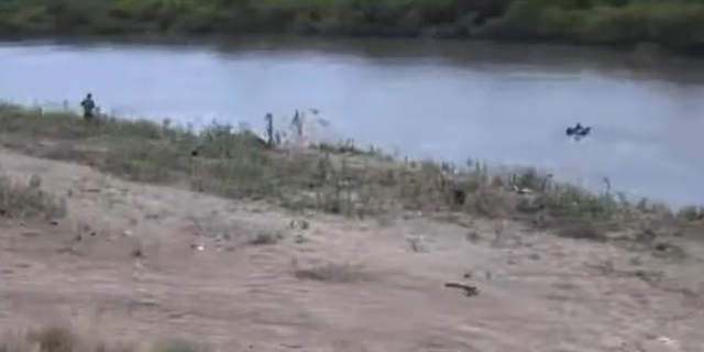 New video appears to show a migrant child drifting down the Rio Grande alone on a flotation device.