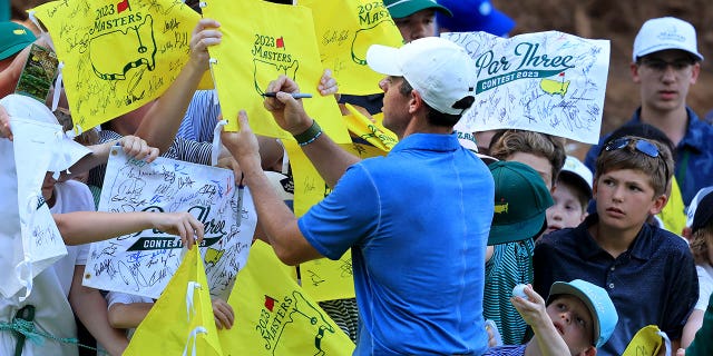 Northern Ireland's Rory McIlroy signs autographs before the 2023 Masters after competing in the par 3 tournament at Augusta National Golf Club on April 5, 2023 in Augusta, Ga.