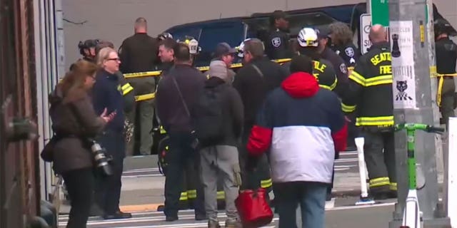 People gather around scene of reported explosion in downtown Seattle