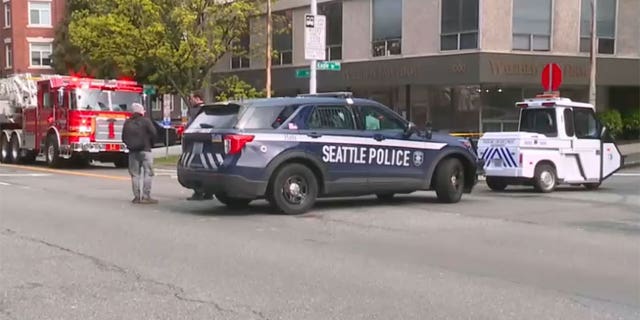 Seattle Police Department vehicles are parked outside of scene of reported explosion