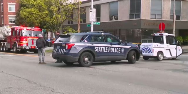 Seattle Police Department vehicles are parked outside of scene of reported explosion