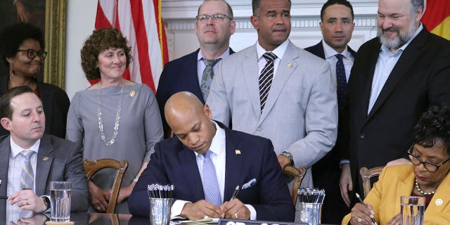 Maryland Gov. Wes Moore signs a bill on April 11, 2023, in Annapolis to end the state's statute of limitations for when child sexual abuse lawsuits can be filed.