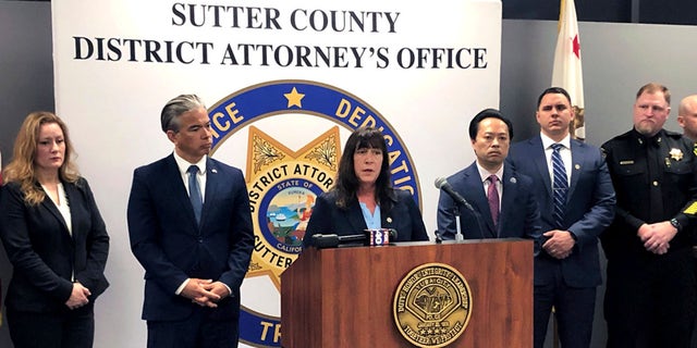 Sutter County District Attorney Jennifer Dupré speaks at a news conference in Yuba City, Calif., on Monday. Dupré announced the arrest of more than a dozen people on charges including conspiracy to commit murder. Dupré says the men are members of one of two rival syndicates in the Sikh community responsible for a series of shootings.