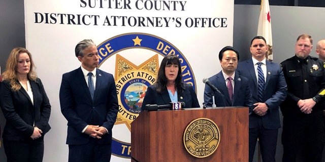 Sutter County District Attorney Jennifer Dupré speaks at a news conference in Yuba City, Calif., on Monday. Dupré announced the arrest of more than a dozen people on charges including conspiracy to commit murder. Dupré says the men are members of one of two rival syndicates in the Sikh community responsible for a series of shootings.