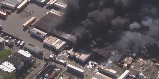 Black smoke over warehouse
