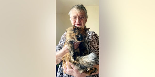 Lila Brissett with cat Rosie, who will turn 32 years old this year. "All my animals seem to live to a good age," said Brissett. 