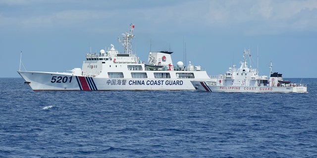 Chinese and Philippine coast guard boats facing off