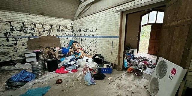 An abandoned bathtub, desk and heating unit can all be seen in the listing photos, showing the true extent of the work needed on an old mortuary.