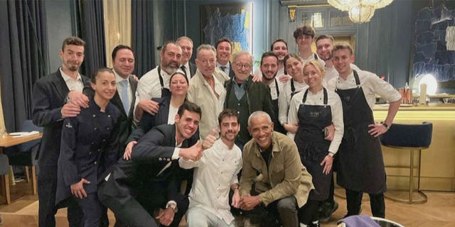 Barack Obama,Steven Spielberg, and Bruce Springsteen smile in photo with Barcelona restaurant staff