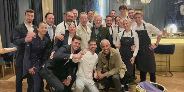 Barack Obama,Steven Spielberg, and Bruce Springsteen smile in photo with Barcelona restaurant staff