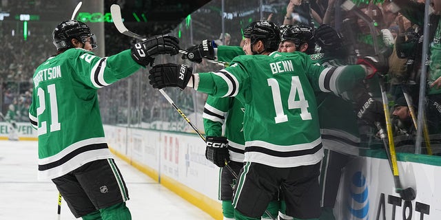 The stars come together after the goal