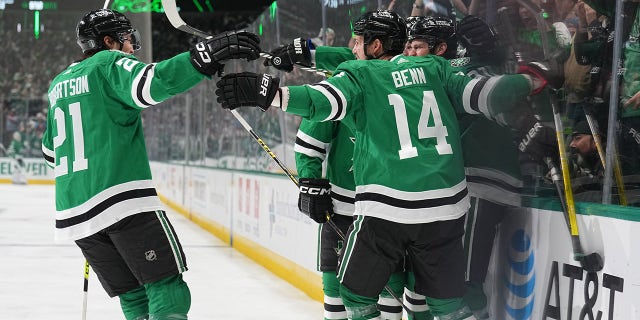 The stars come together after the goal