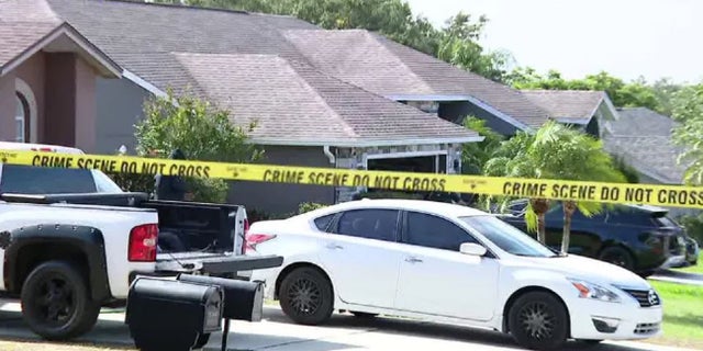 Law enforcement outside fatal hostage scene in Polk County where a man killed his stepson and then himself.Â