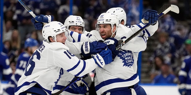 Toronto Maple Leafs center John Tavares (91) celebrates with right wing Mitchell Marner (16)