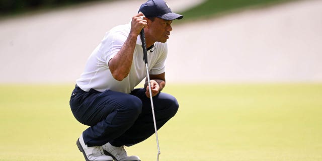 Tiger Woods lines up a putt on the 13th green during the Masters Tournament on April 6, 2023.