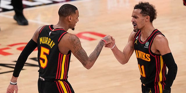 Dejounte Murray and Trae Young fist pound