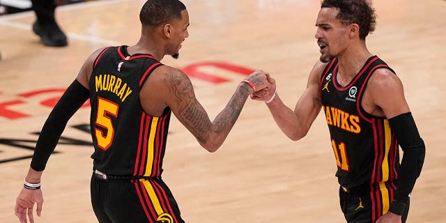 Dejounte Murray and Trae Young fist pound