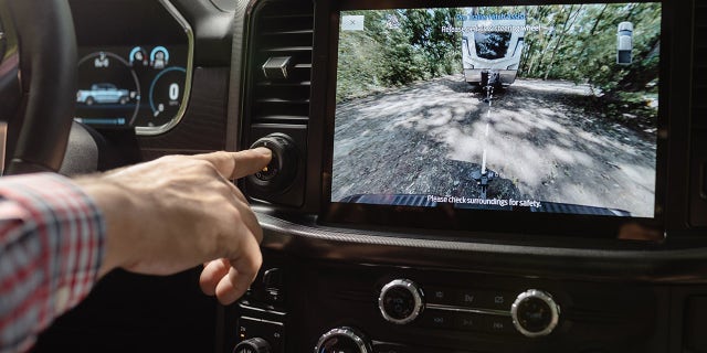 Pro Trailer Hitch Assist is incorporated into the same dashboard controller as the Pro Trailer Backup Assist feature.