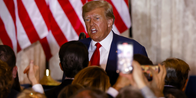 Former US President Donald Trump departs after delivering remarks at the Mar-a-Lago Club in Palm Beach, Florida, US, on Tuesday, April 4, 2023. Trump entered a not-guilty plea to 34 counts of falsifying business records in the first degree in a proceeding that took a little less than an hour. 