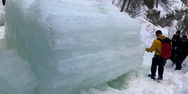 The 41-year-old woman was able to push a 21-year-old climber to safety before the fractured ice column crushed her, authorities said.