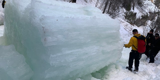 The 41-year-old woman was able to push a 21-year-old climber to safety before the fractured ice column crushed her, authorities said.