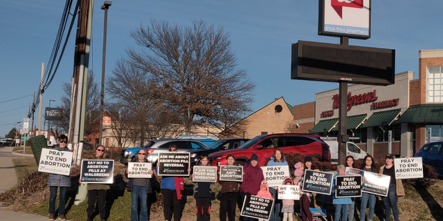 40 Days for Life members demonstrate outside a Walgreens.