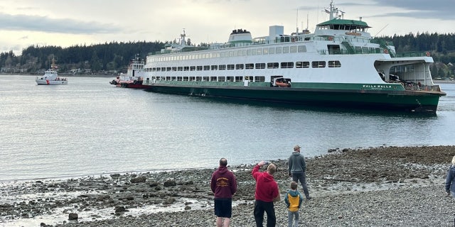 Walla Walla ferry stuck in shallow water near a beach