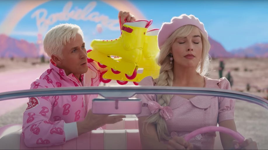 Ryan Gosling as Ken and Margot Robbie as Barbie driving pink car