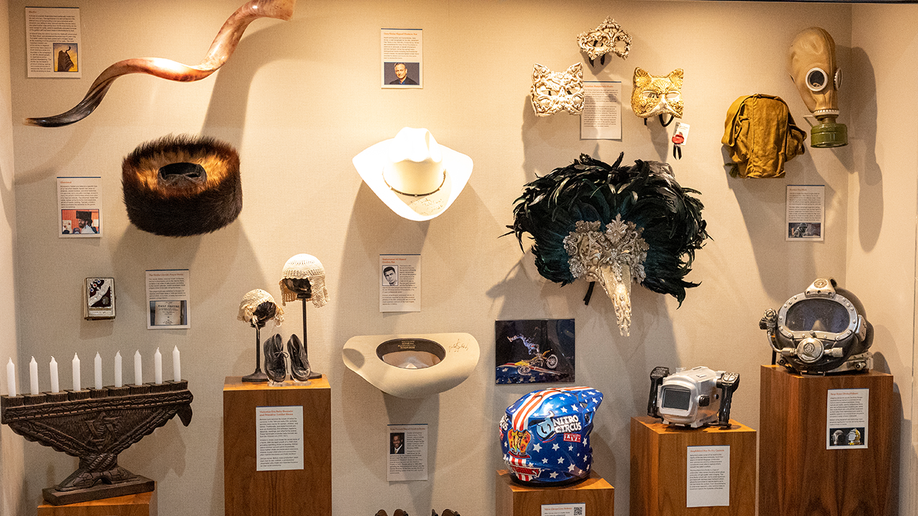 Masks, headwear, fashion accessories and decor on display at Unclaimed Baggage Museum.