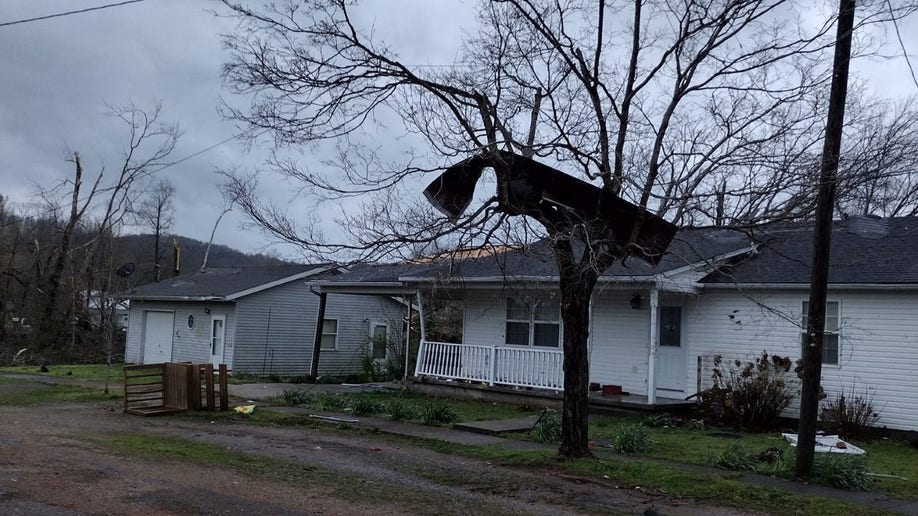 Debris sits in a tree following a Missouri tornado