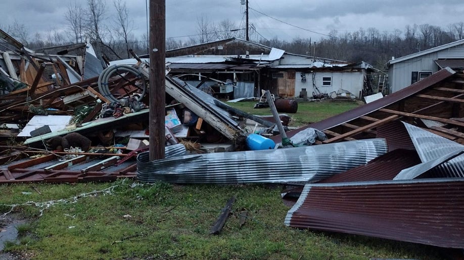 A telephone pole and tornado debris in Missouri