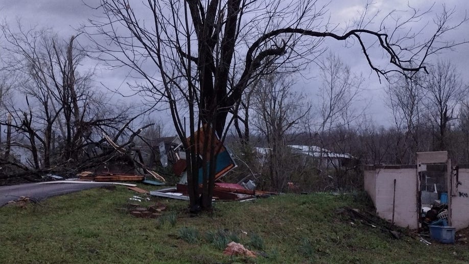 A road blocked by tornado debris